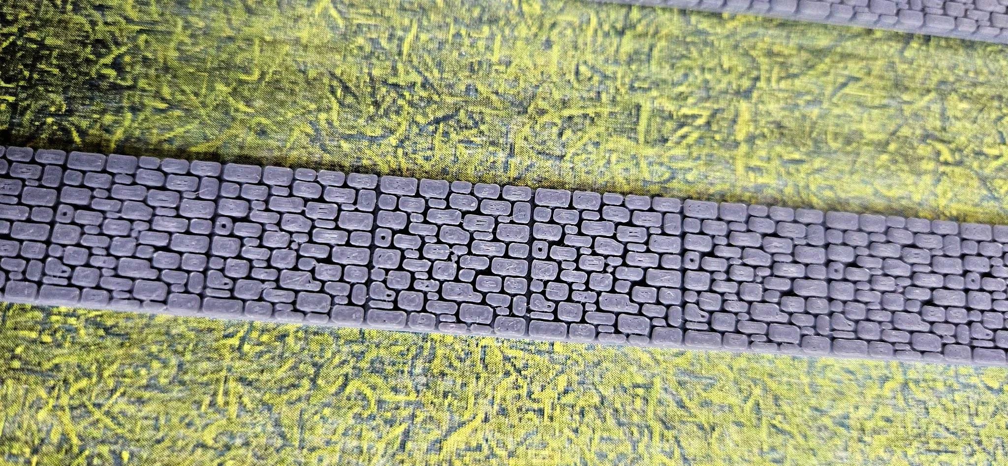 Front view of N scale stone fence walls